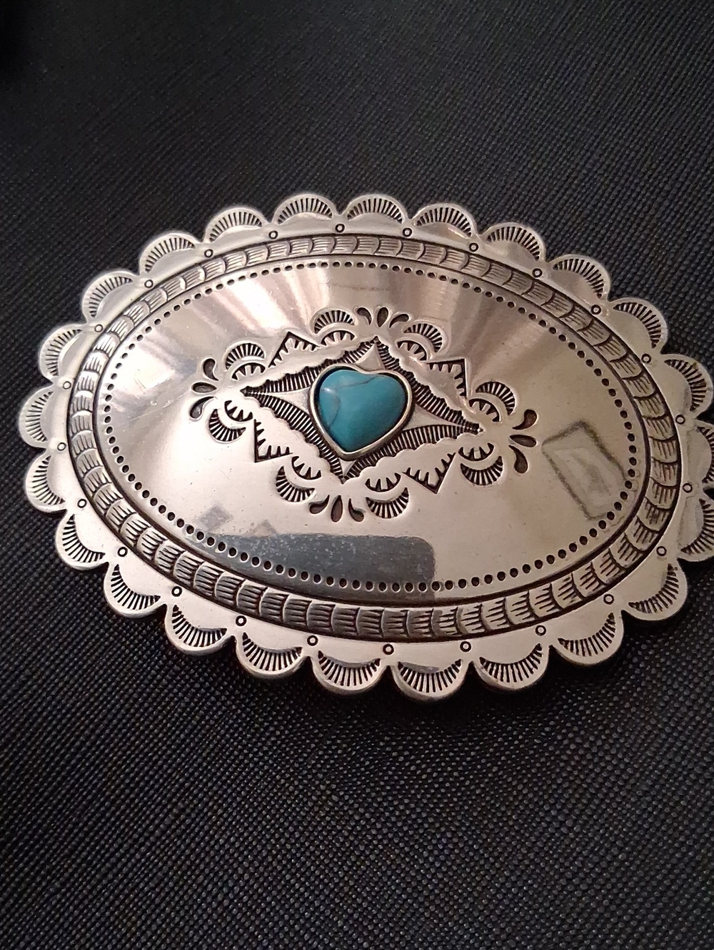 Silver Belt Buckle.